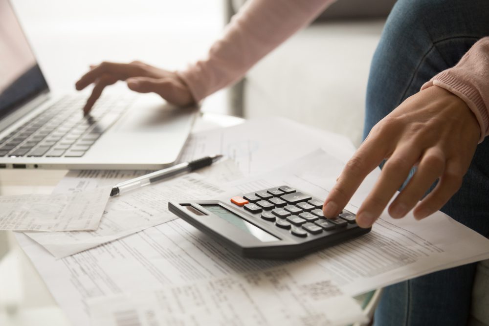 Woman Calculating Debt
